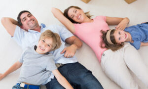 Asthma Happy Family Lying On Floor Shutterstock 185216222