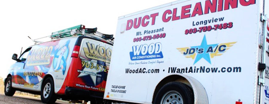 Wood Air Conditioning & Plumbing van and trailer